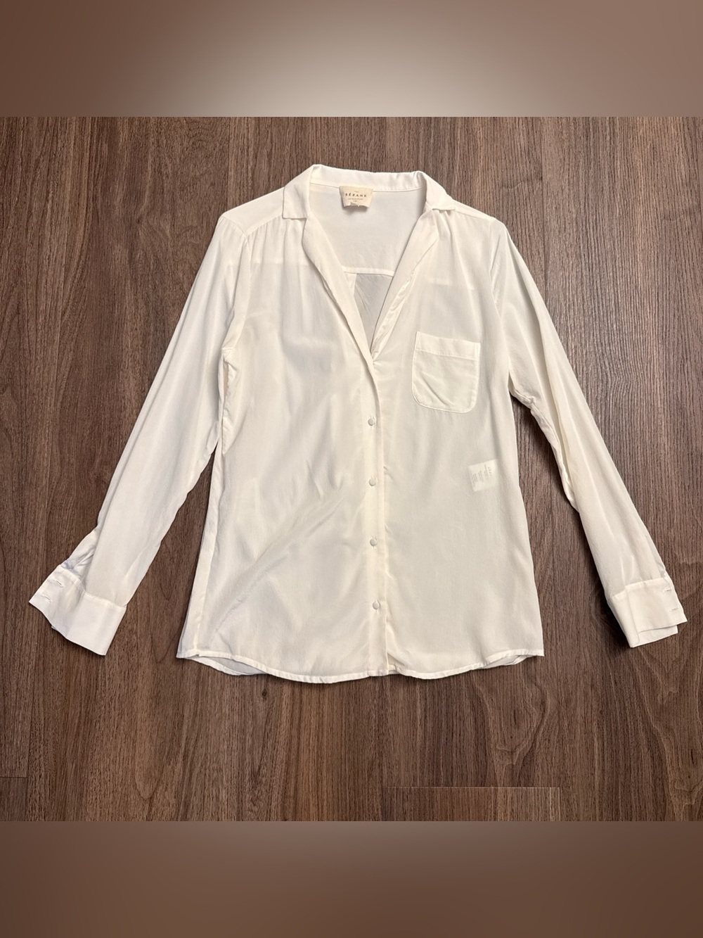 Sézane cream button up blouse with a pocket. Size 36 100% silk.